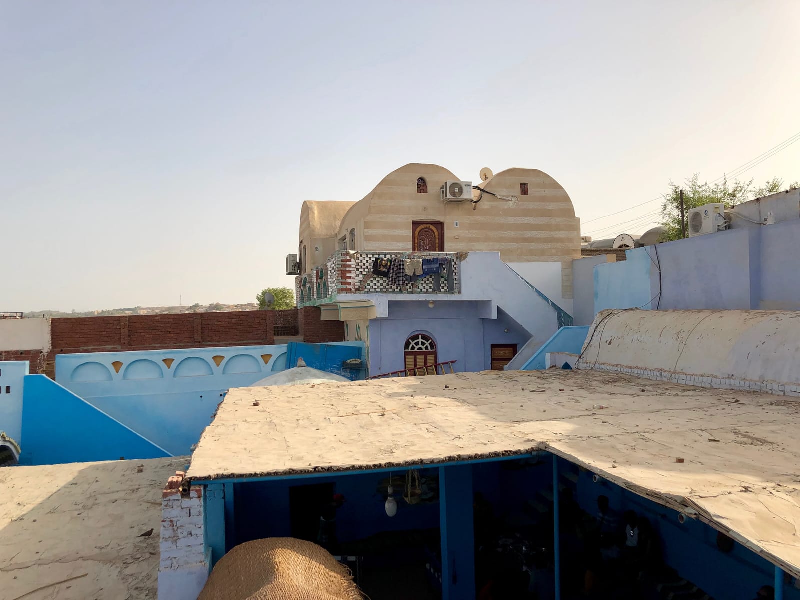 A brightly painted Nubian house with a domed roof in Upper Egypt