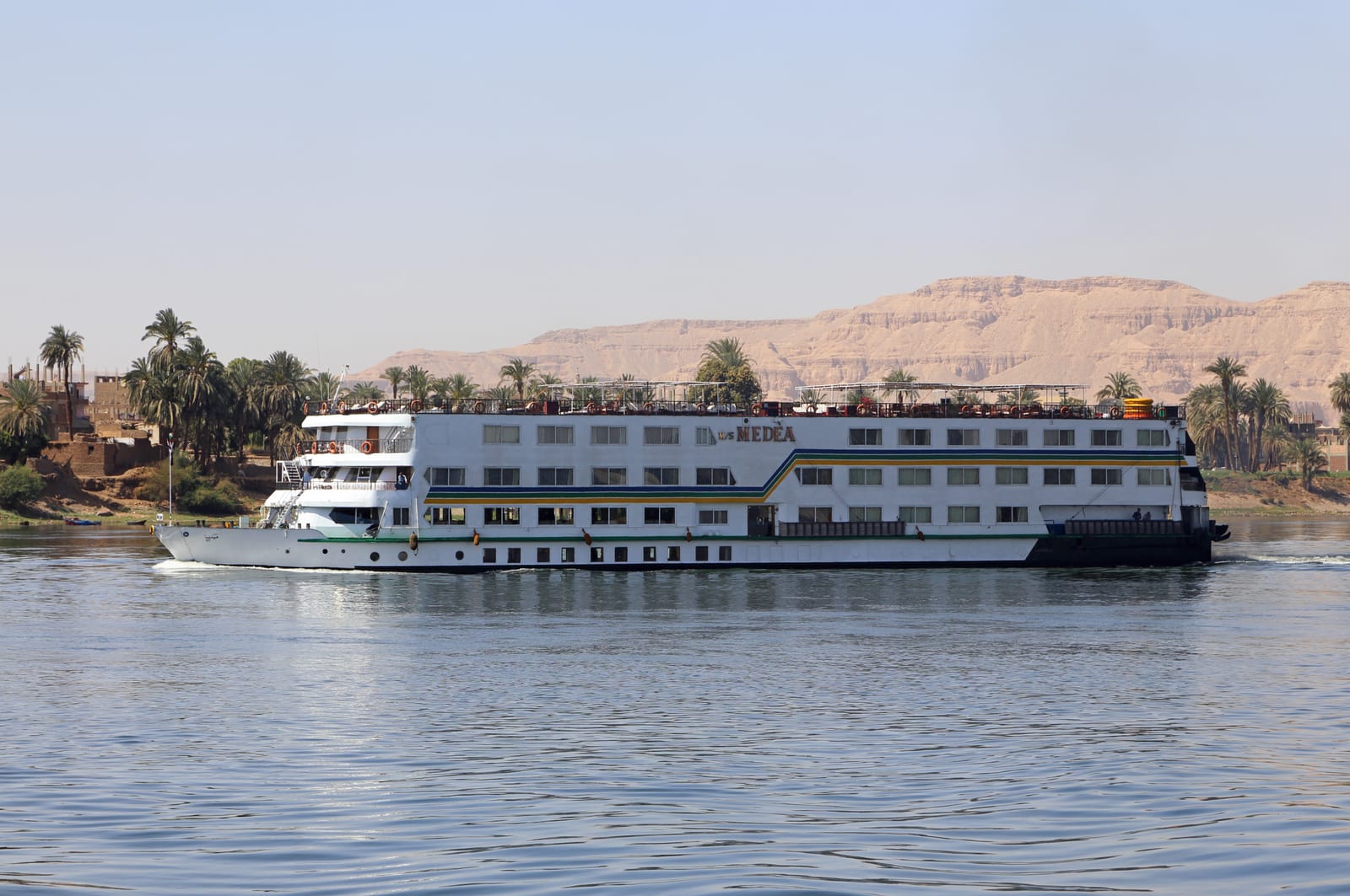 Nile cruise ship moored on the river bank in Upper Egypt